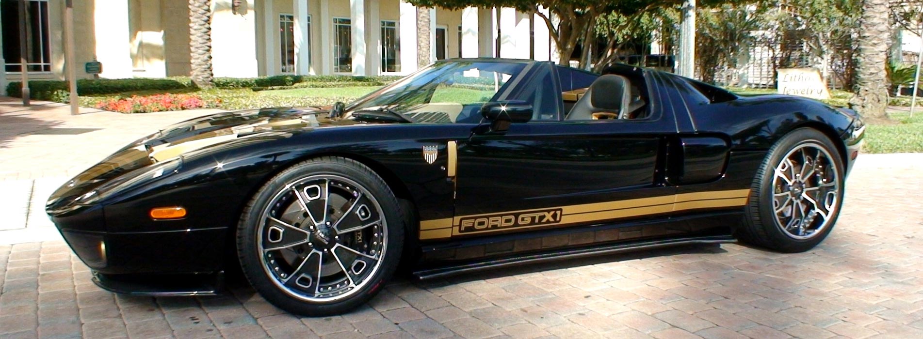 Black Ford GTX-1 with gold racing strips on bottom panel