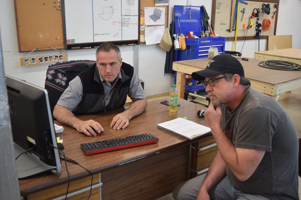 Knights Upholstery designer working with a client at full-service upholstery shop