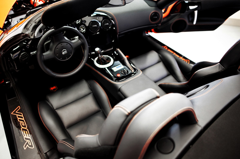 Orange Dodge Viper interior front seat and steering wheel automotive upholstery by Knights Upholstery in Wisconsin